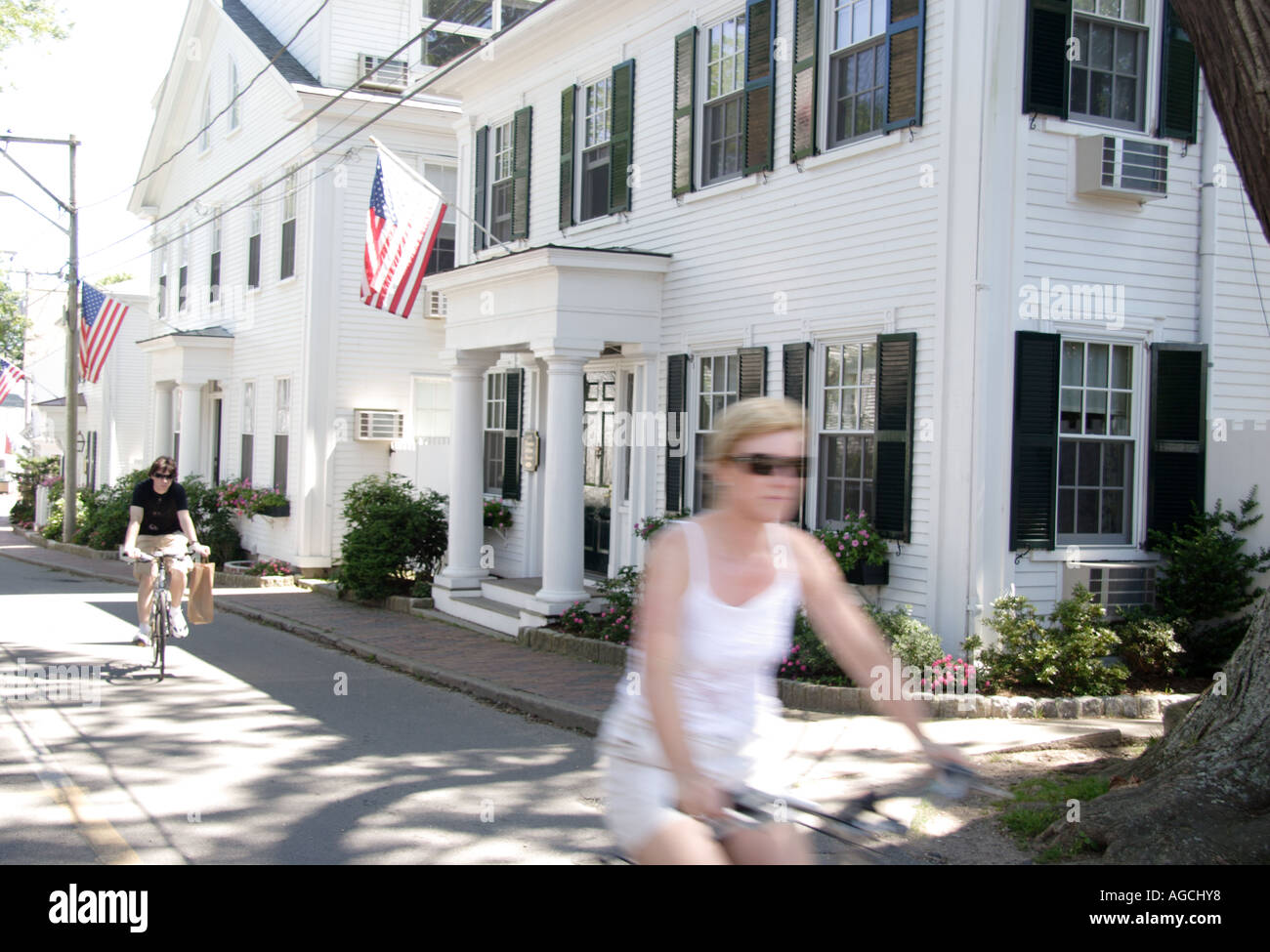 Tourist cycling in Edgartown Cape Cod Stock Photo Alamy