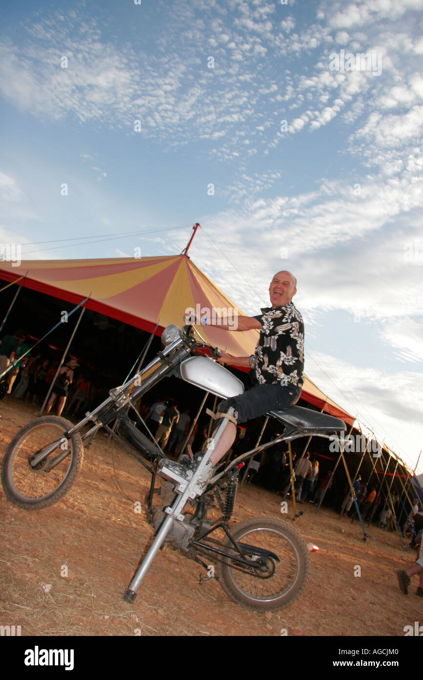 A crazy man on a strange motorbike during a festival Stock Photo