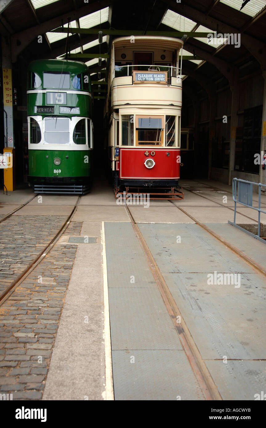 Two vintage trams in the tram shed about to leave the depot, at Crich Tramway Museum Stock Photo
