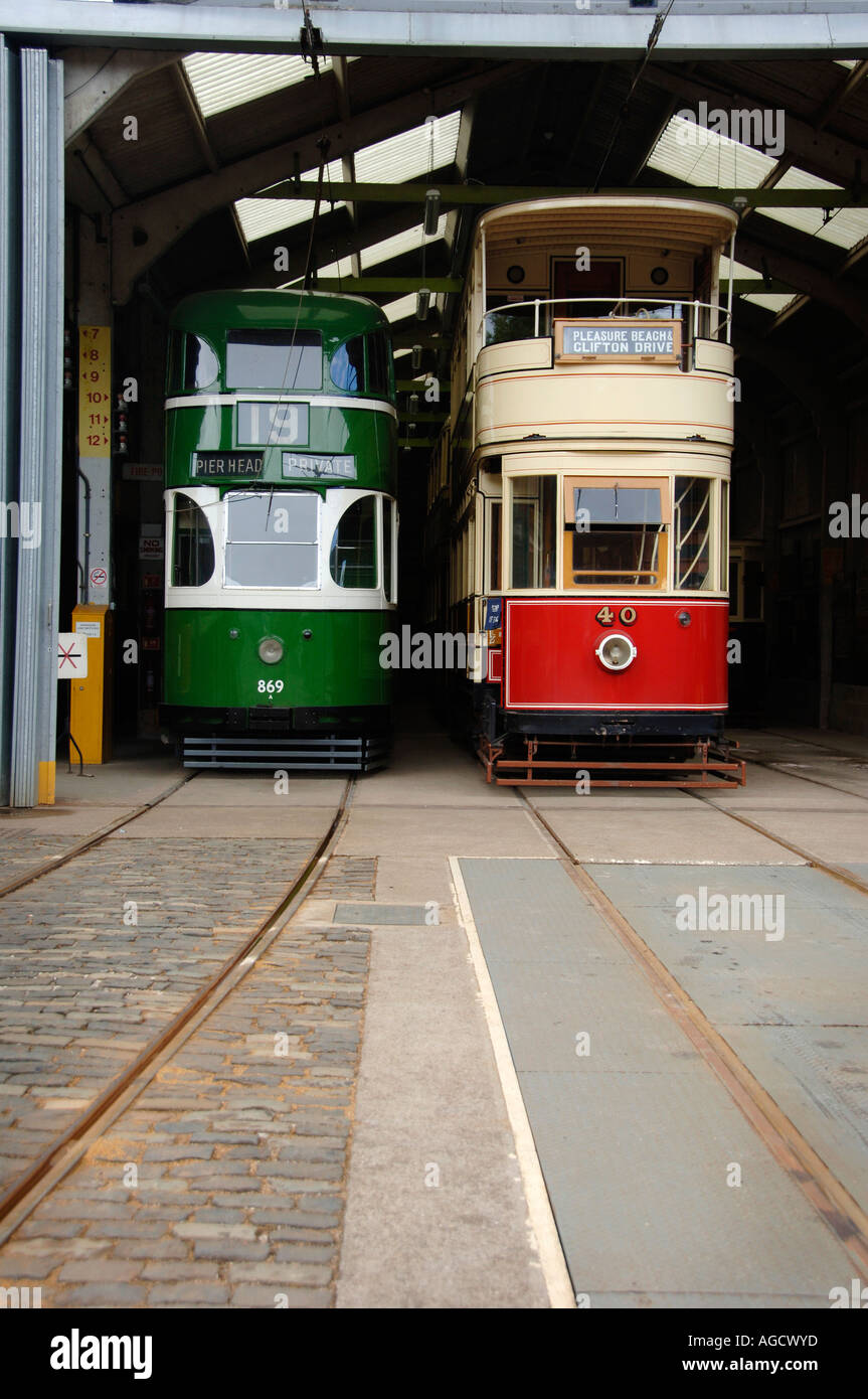 Two vintage trams in the tram shed about to leave the depot, at Crich Tramway Museum Stock Photo