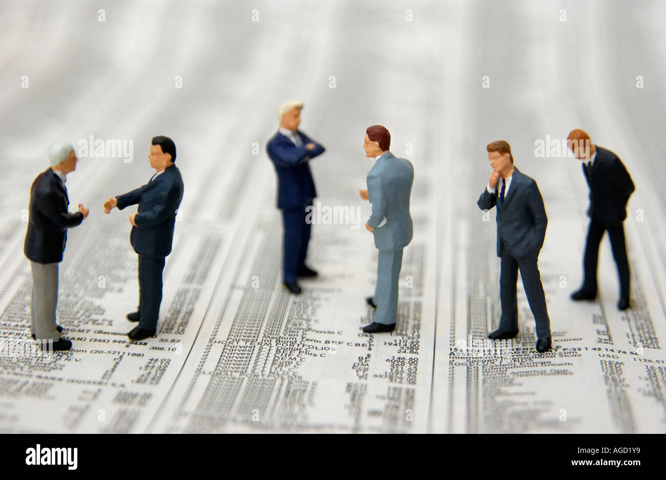 Stock market / Economy concept - business men standing on stock market stocks and shares prices Stock Photo