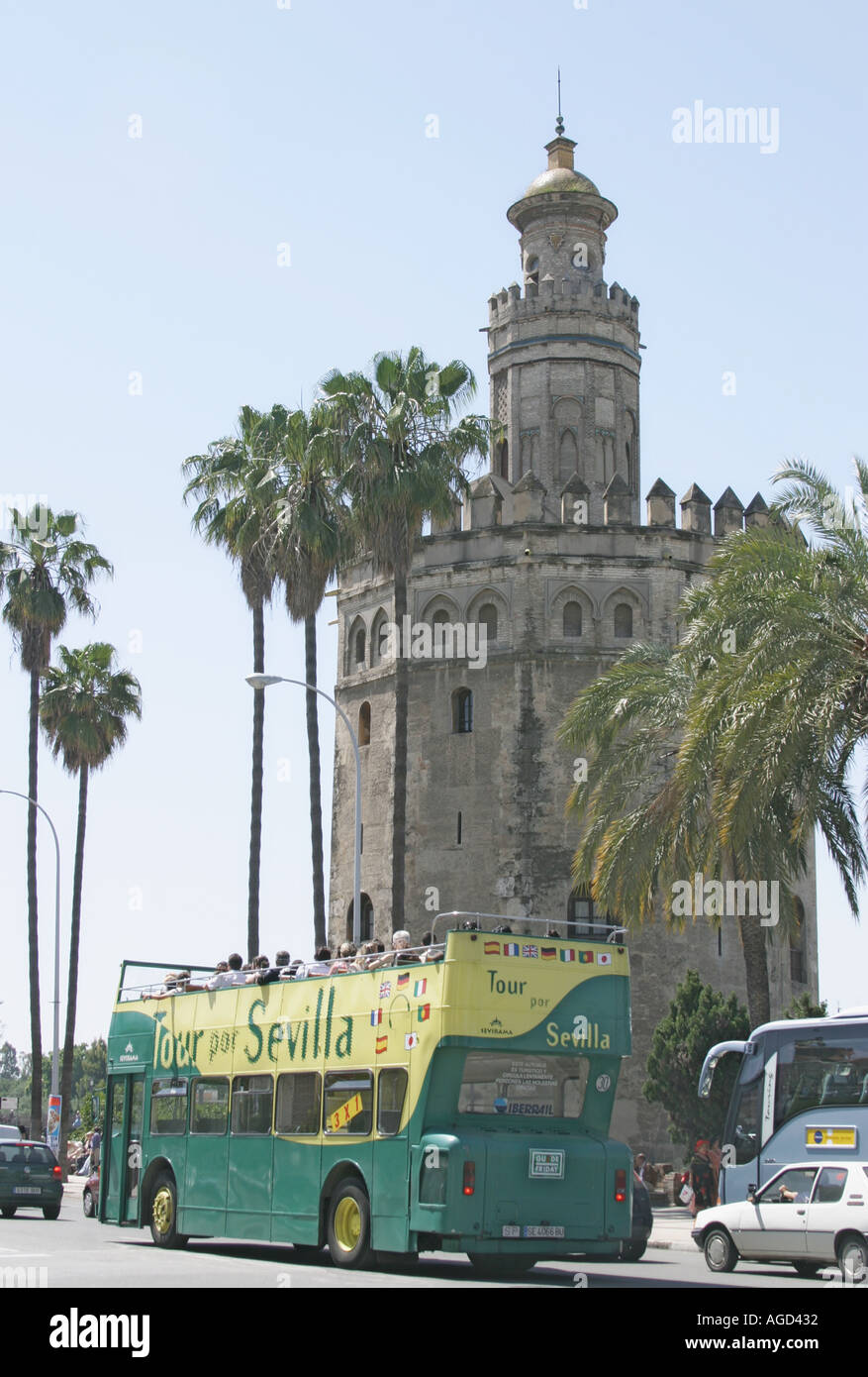 Seville Spain City tour bus in front of Torre del Oro Stock Photo