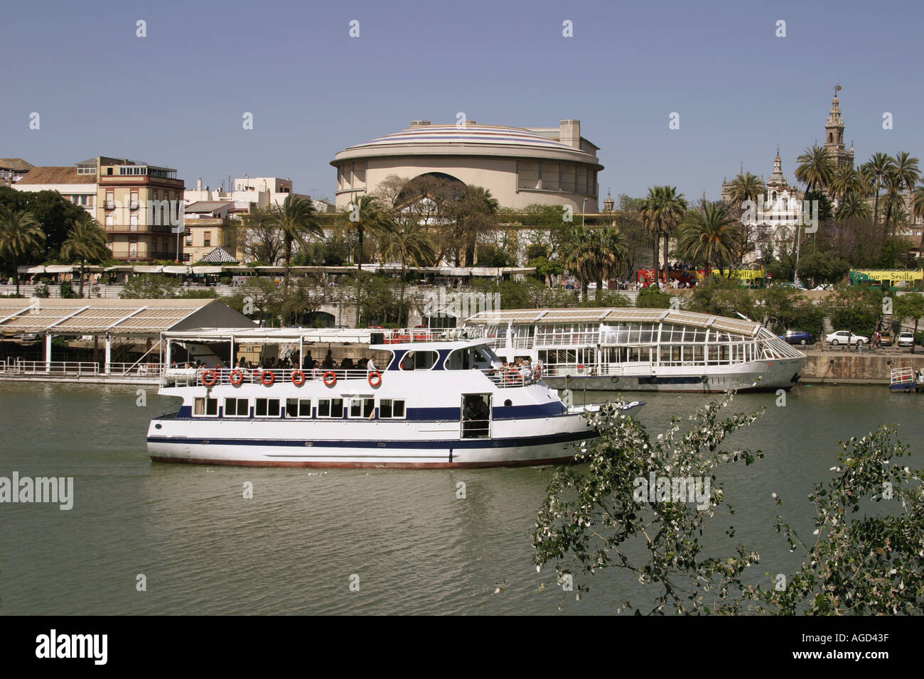 Seville Spain Tour boat in front of Teatro de la Maestranza Stock Photo