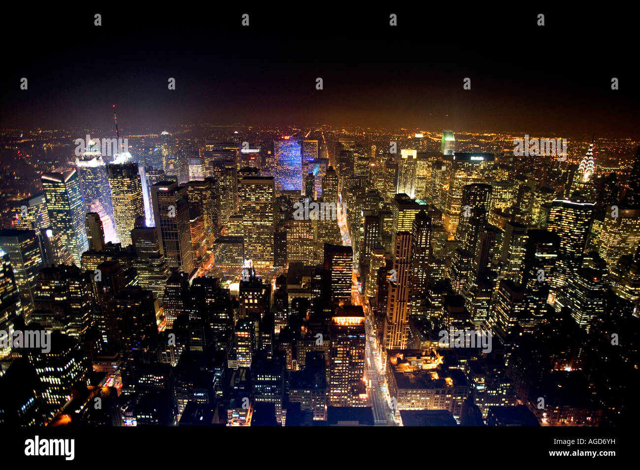 New York city skyline as seen from the Empire State building at night ...