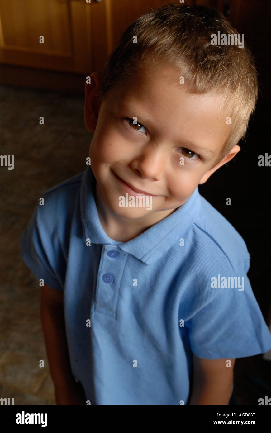 Portrait of a little boy with blonde hair wearing school uniform Stock Photo