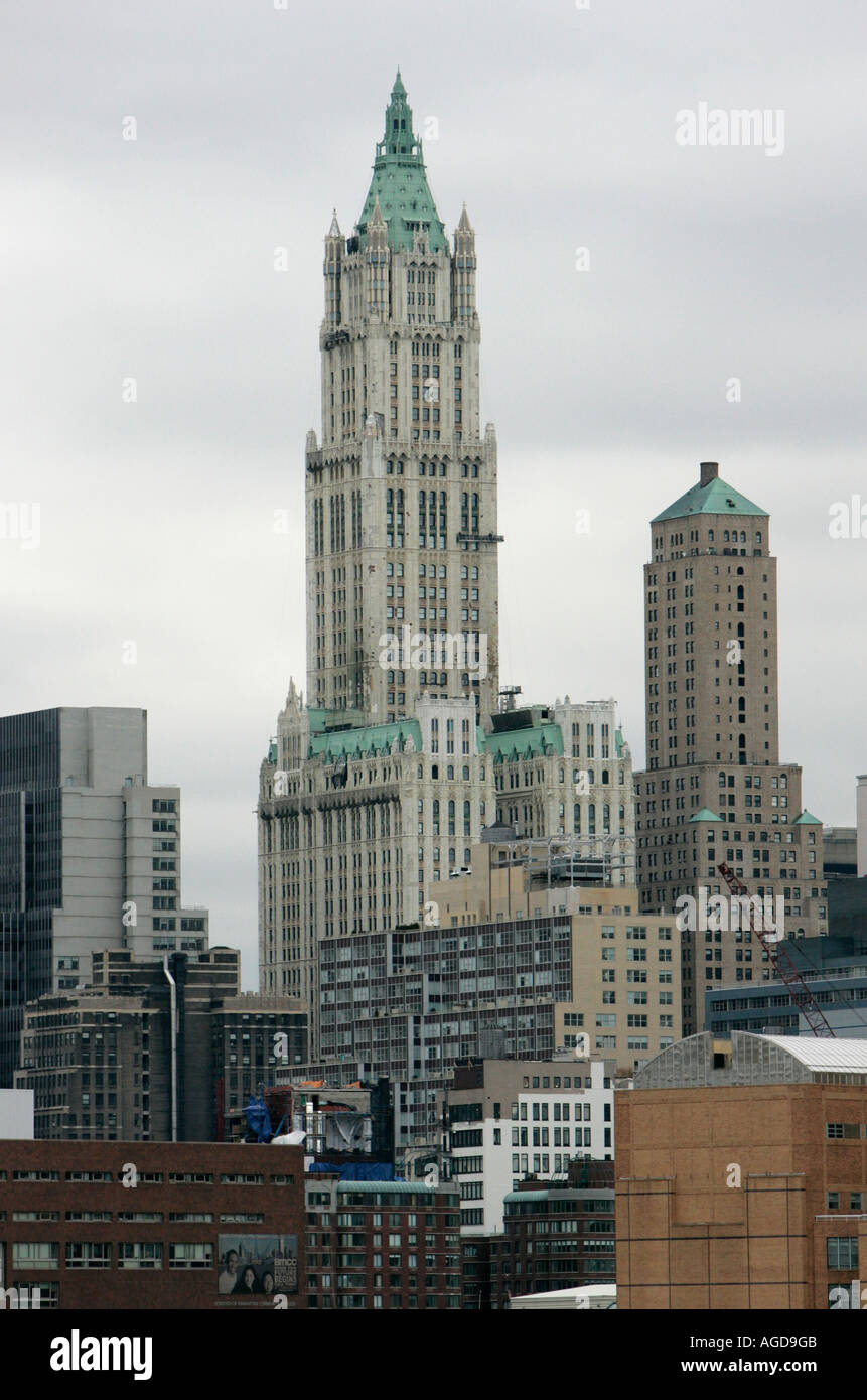 top of the Woolworth and transportation building 233 Broadway against a grey sky from the hudson river Stock Photo
