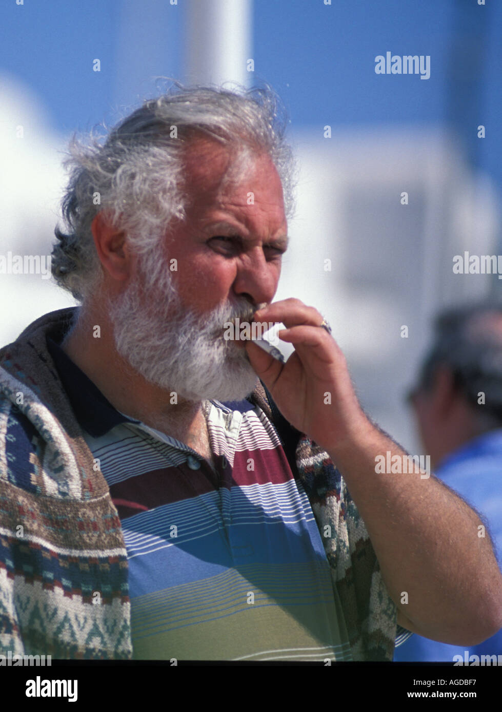 middle aged man smoking cigarette Stock Photo