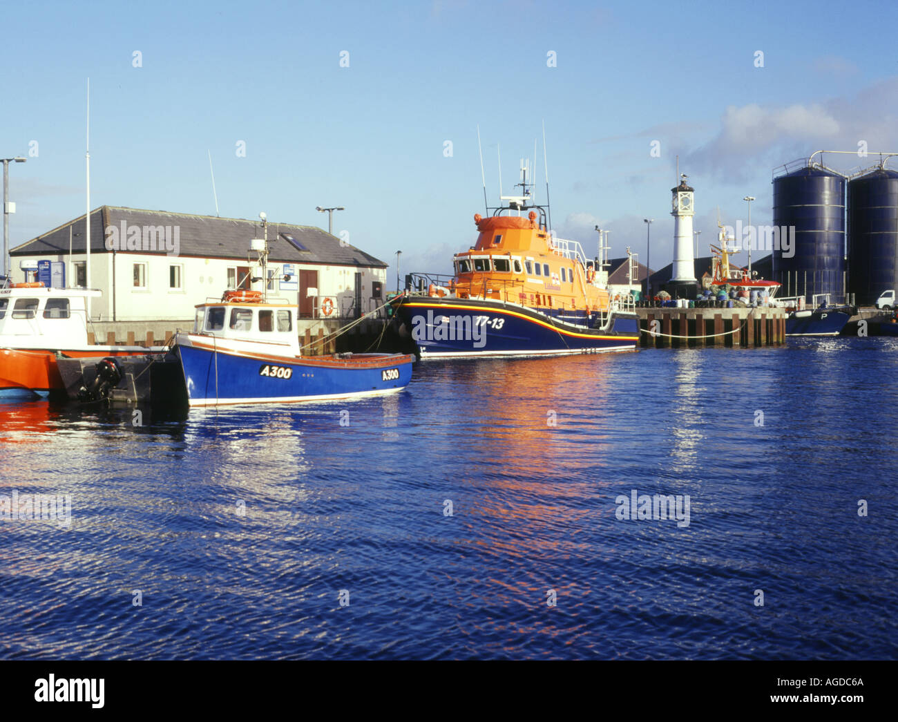 dh Rnli lifeboat scotland KIRKWALL HARBOUR ORKNEY ISLES Quayside fishing boats RNLB life boat Stock Photo