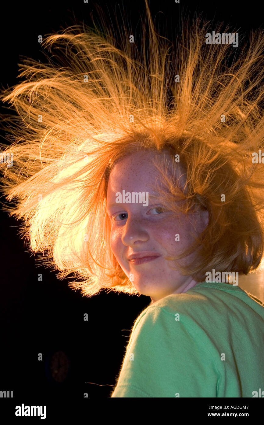Static electricity in a girls hair from a Van de Graaff Generator at the Discovery Center in Little Rock, Arkansas. Stock Photo