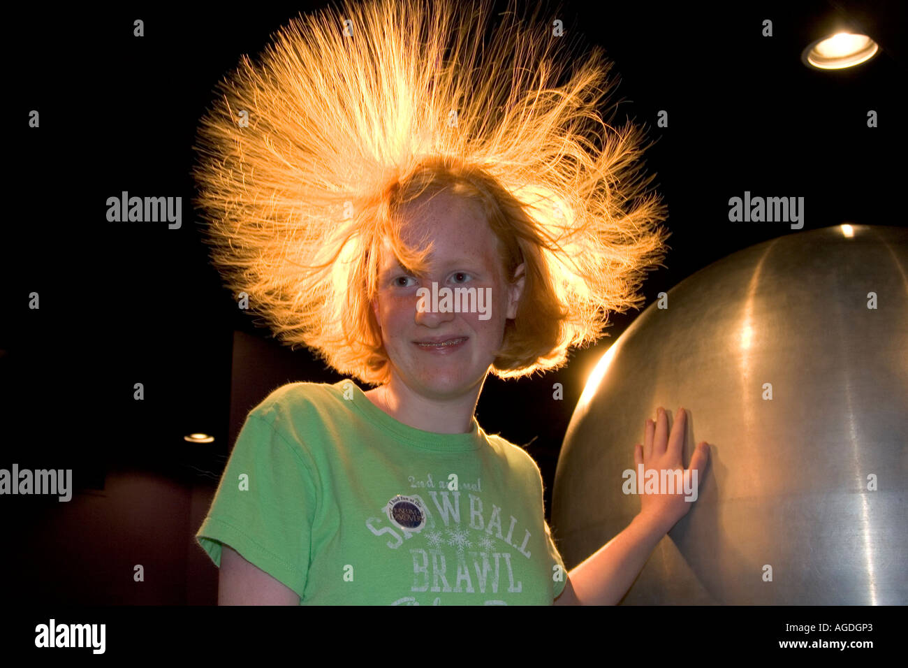 Static electricity in a girls hair from a Van de Graaff Generator at the Discovery Center in Little Rock, Arkansas. Stock Photo