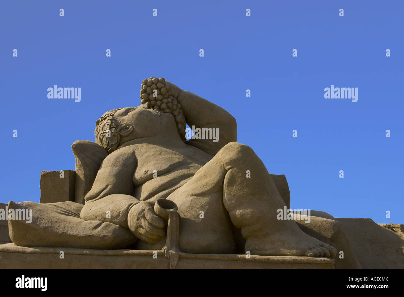Sand sculpture of Dionysus, god of fruit and wine, at Great Yarmouth sand sculpture festival. Stock Photo