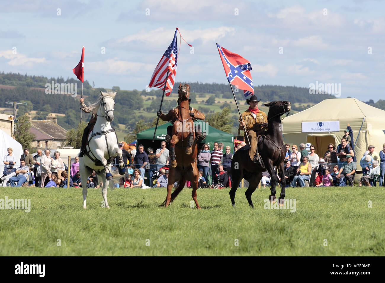 Horsemen with American flags horses rearing up Stock Photo