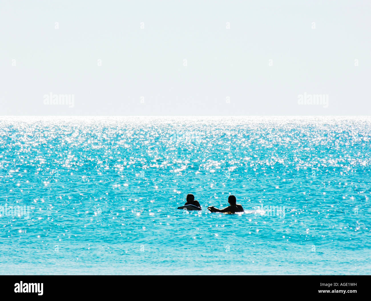 Two surfers on surfboards waiting for wave Stock Photo