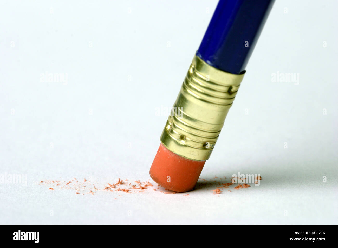 Eraser on the end of a pencil rubbing out on a white sheet of paper Stock Photo Alamy