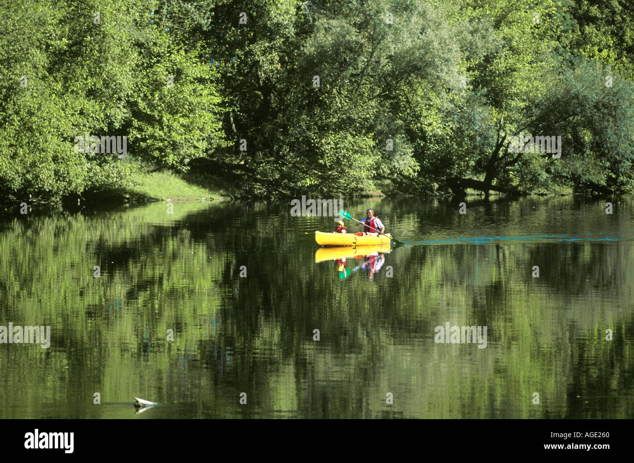 FATHER AND SON CANOEING ON THE DORDOGNE RIVER PERIGORD FRANCE Stock Photo Alamy