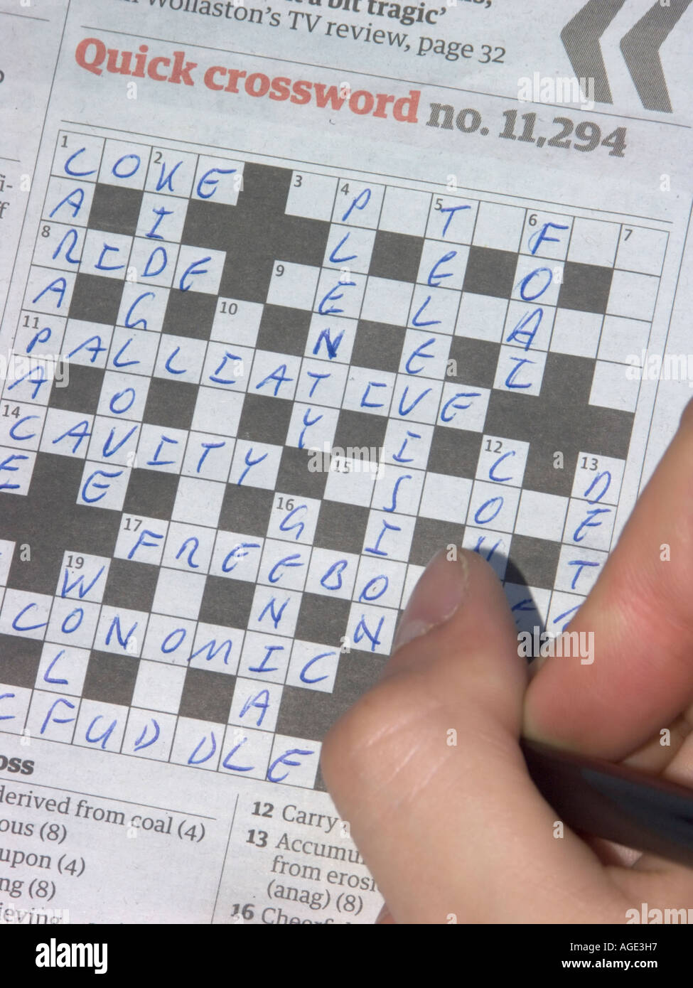 Finishing the crossword Stock Photo Alamy Finishing the crossword Stock Photo Alamy