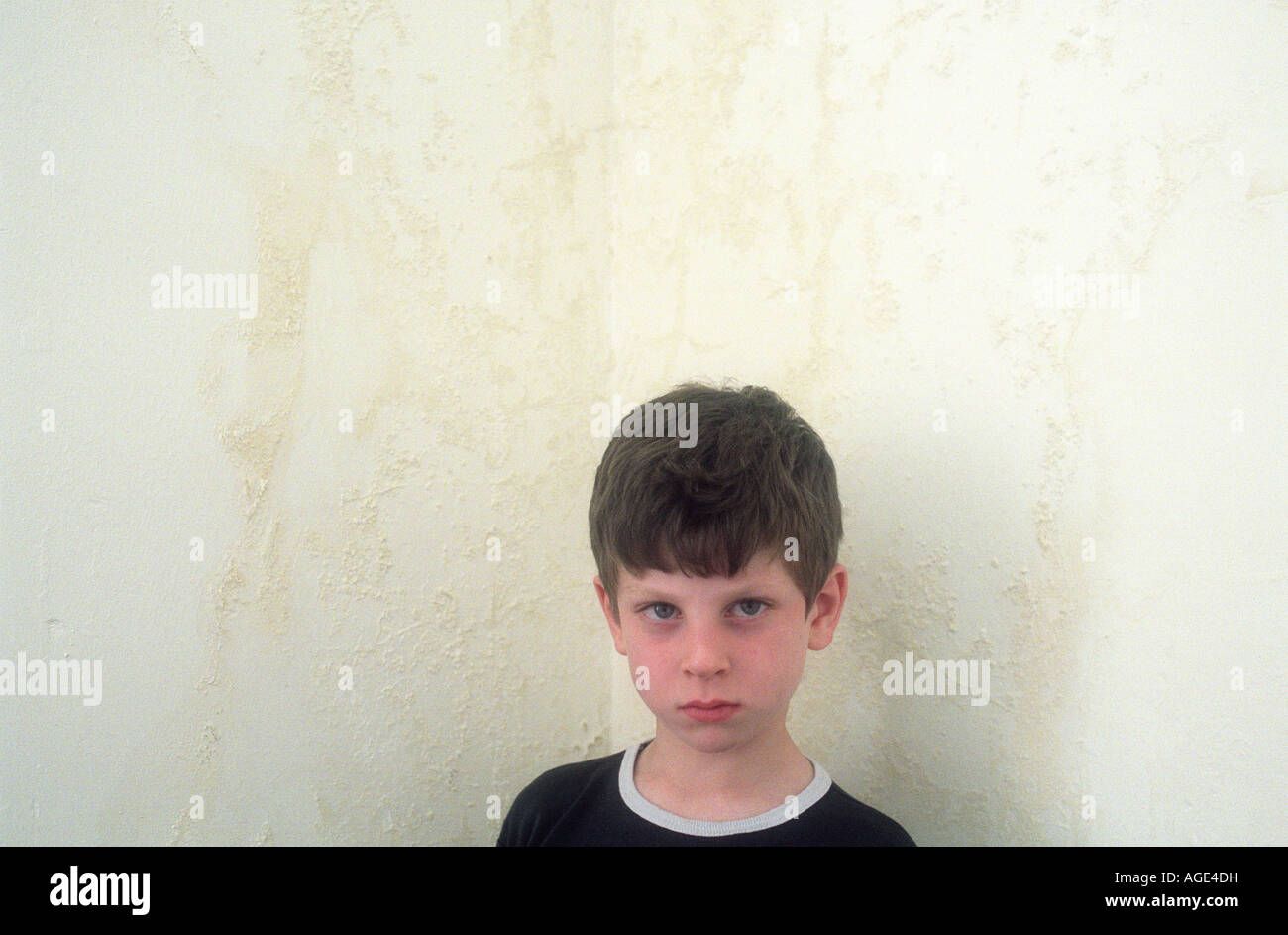 Boy standing in corner hires stock photography and images Alamy