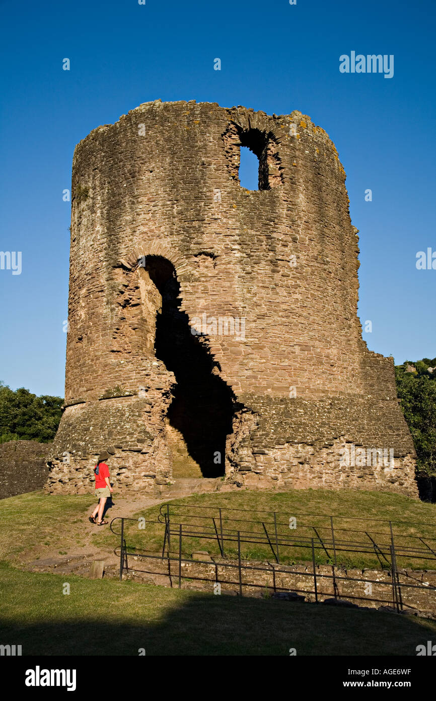 Female visitor at the round keep Skenfrith Castle built between 1219 ...