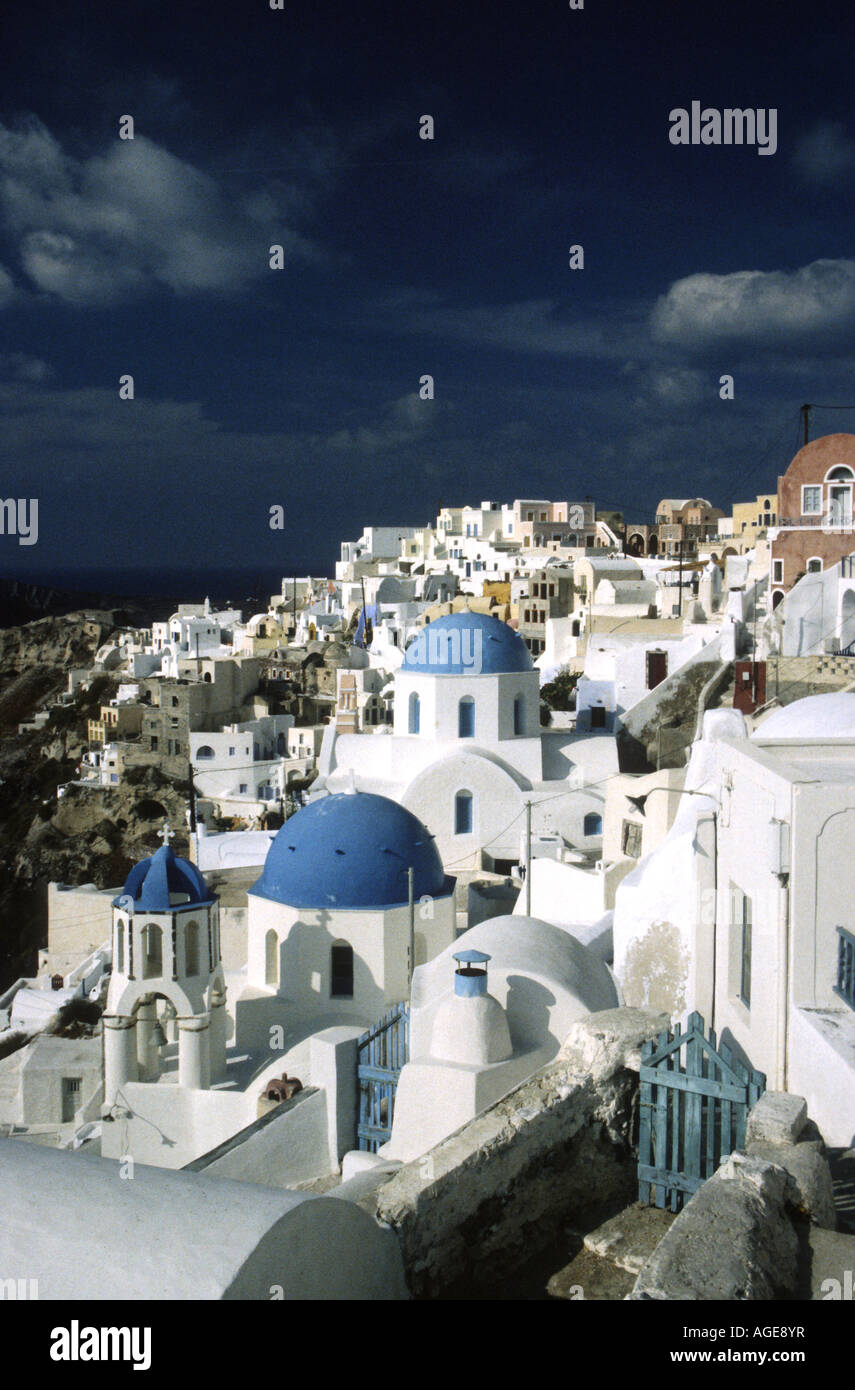 The blue domes of Oia stand our against the whitewashed buildings on Santorini. Stock Photo