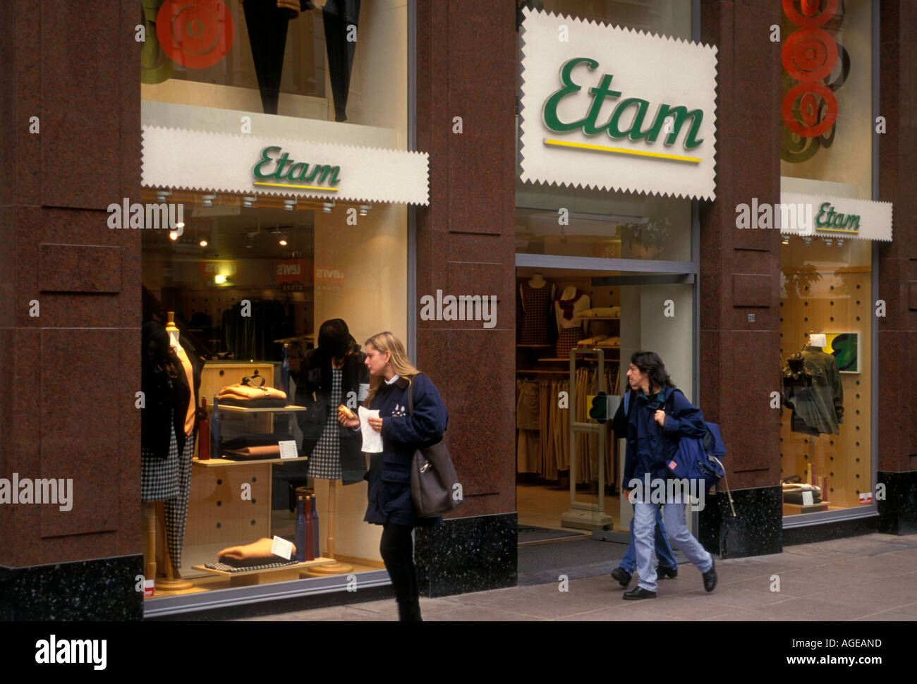 Belgian people young woman window shopping at clothing store along The Meir in the city of
