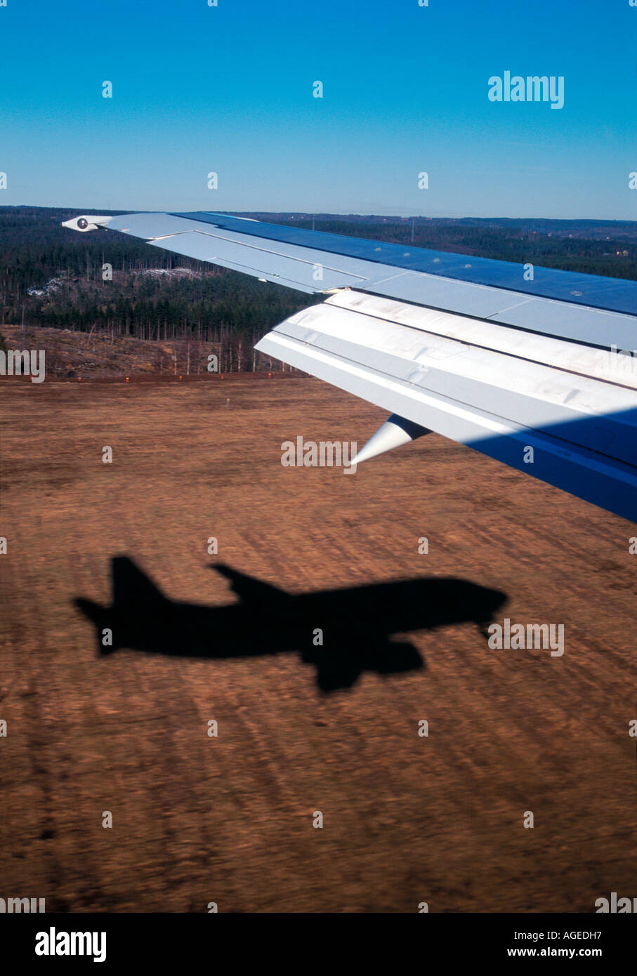 View trough the window on an aeroplane wing with flaps out and ...