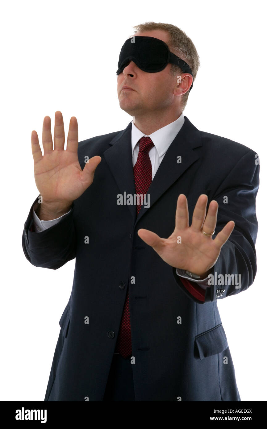 Businessman wearing a blindfold Concepts Confusion Lost Searching Unsure plus many more Stock Photo