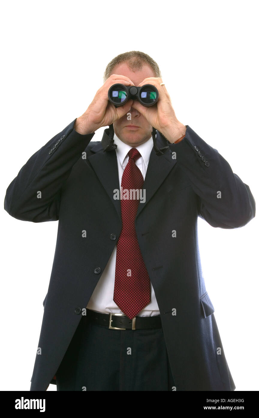 Businessman using a pair of binoculars Stock Photo