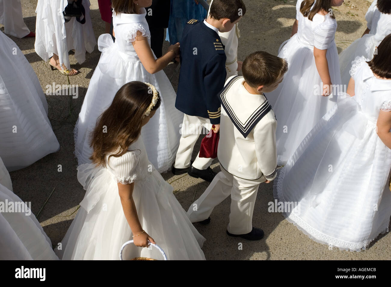 Children in first communion dresses in Corpus Christi procession Castilleja  del Campo Seville Spain Stock Photo - Alamy