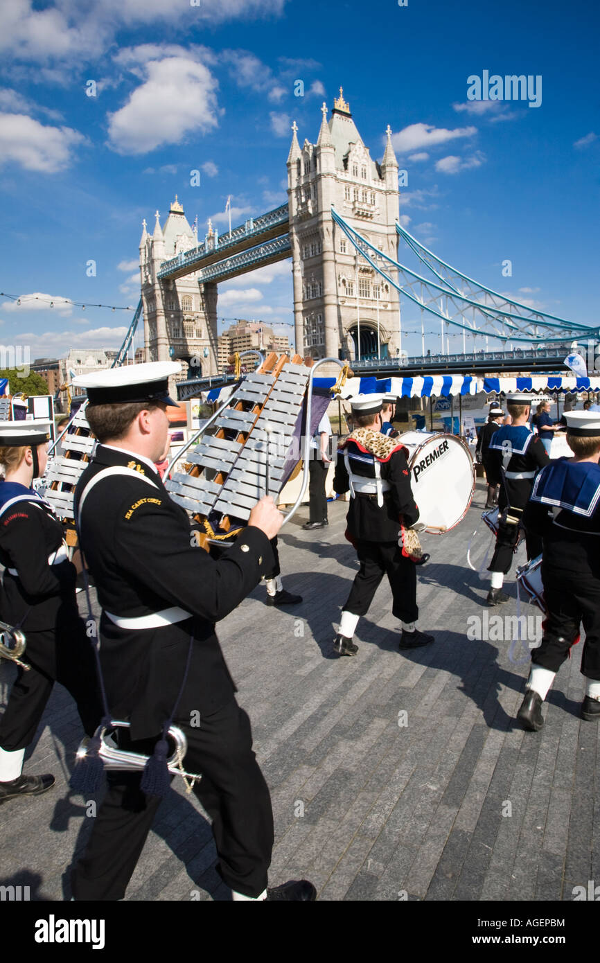 A marching band passes Tower Bridge during the 2007 Thames Festival