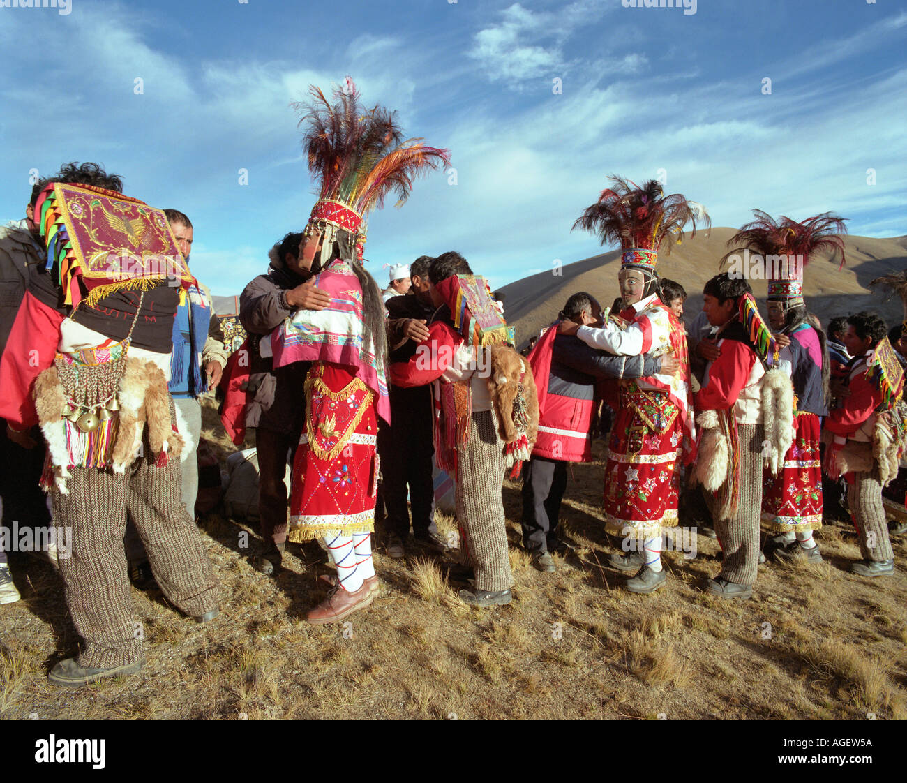 Peruvians celebrate in traditional costume honoring the sunrise at the Festival De Qoylluriti in the  mountains of Peru Stock Photo