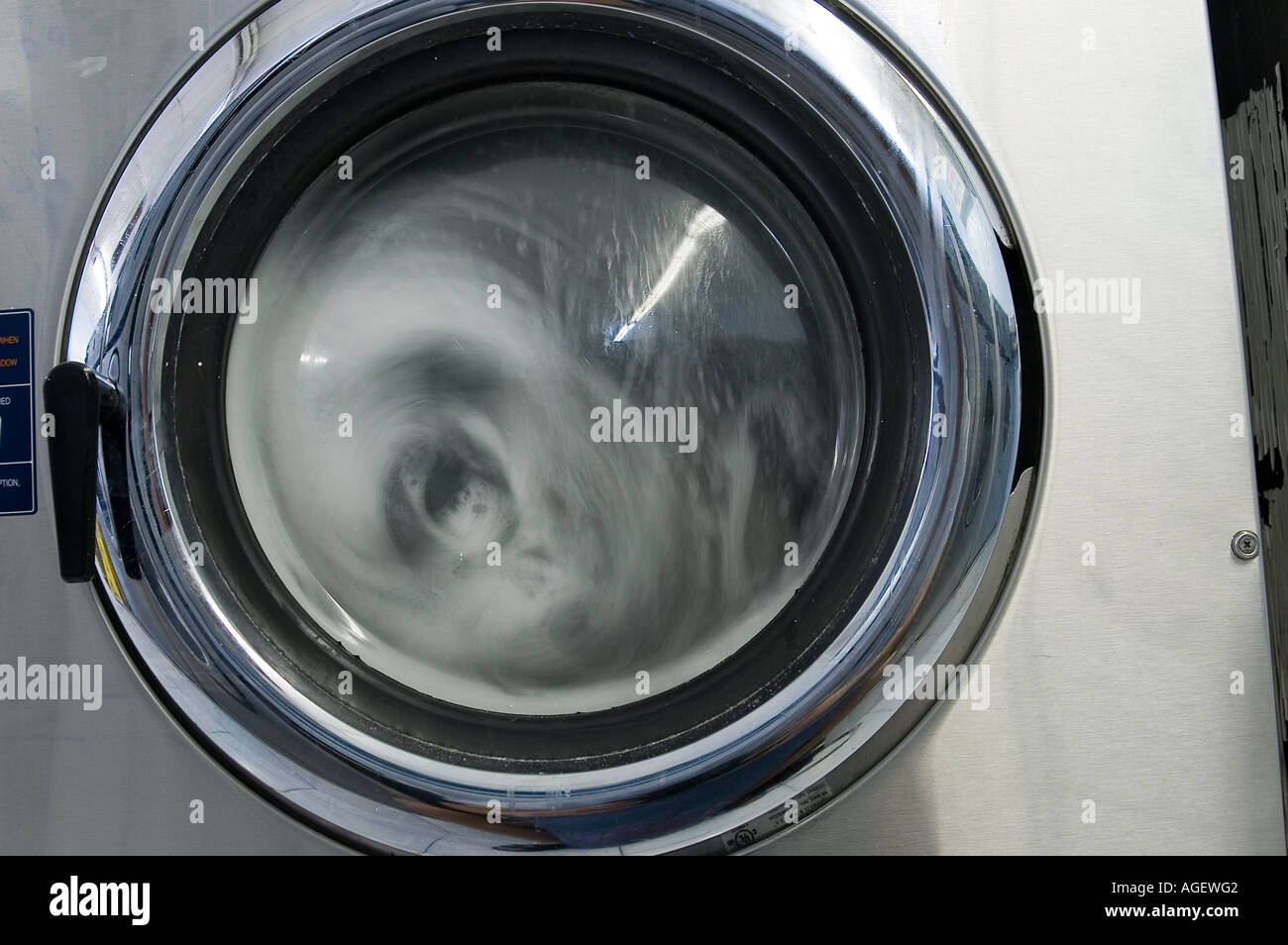 Laundromat during wash cycle Stock Photo Alamy
