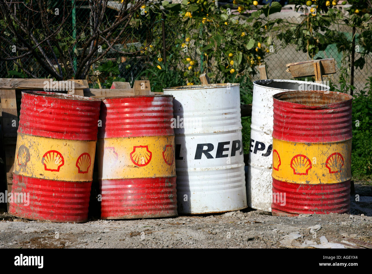 old oil containers shell repsol Stock Photo Alamy