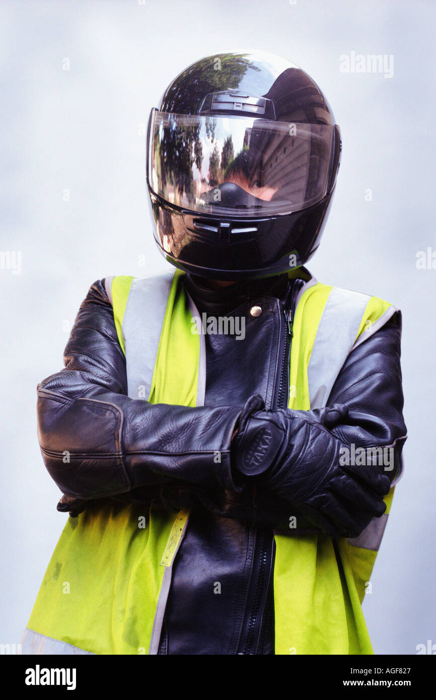 Motorcyclist wearing crash helmet Stock Photo