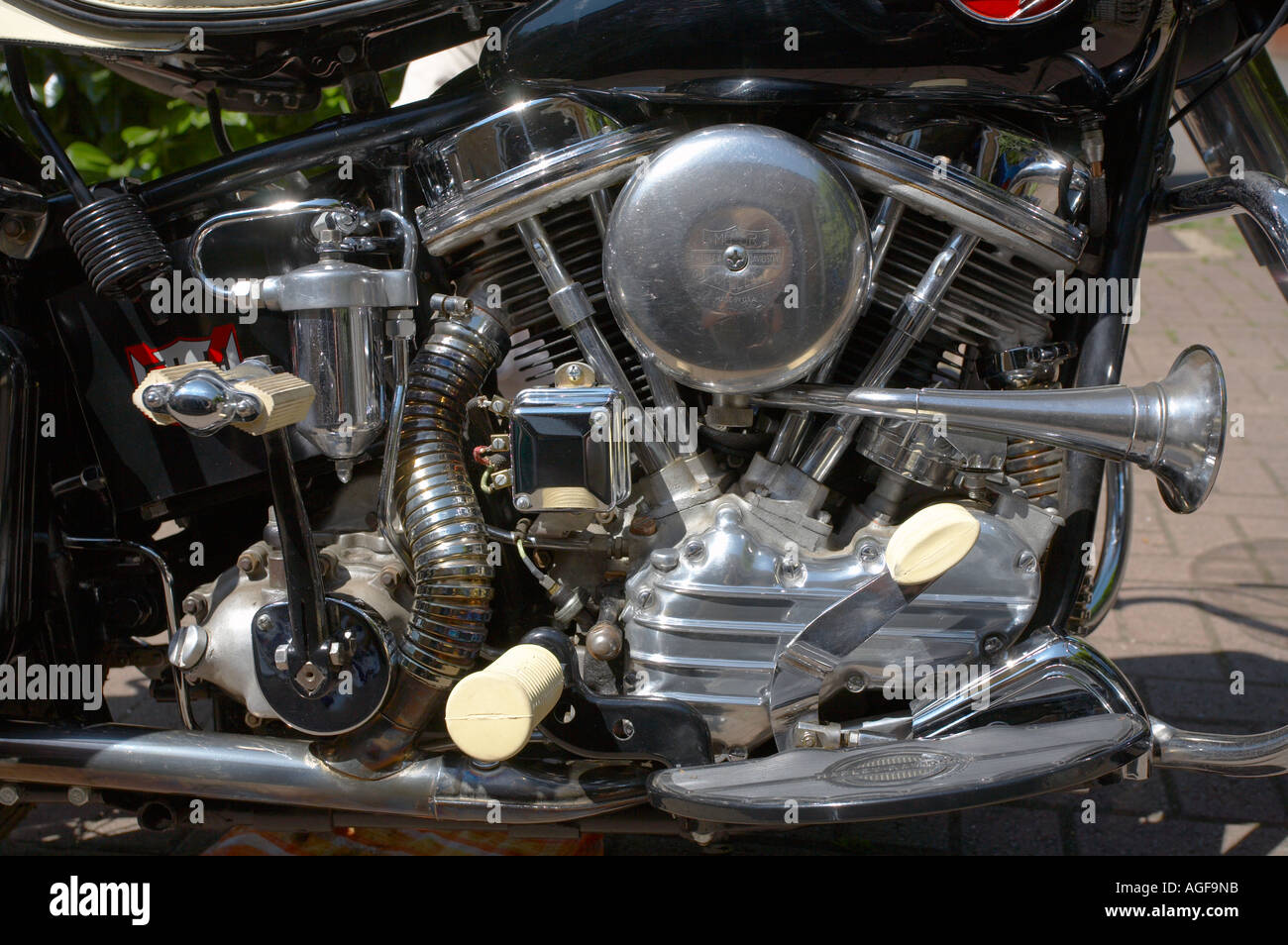 Close up of the engine kick start horn and rear brake pedal on an imaculate 1960 Harley Davidson