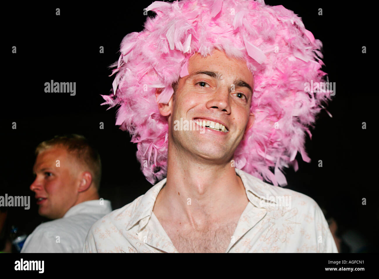 Guy in pink feather wig at the TDK Cross Central Festival London Stock Photo