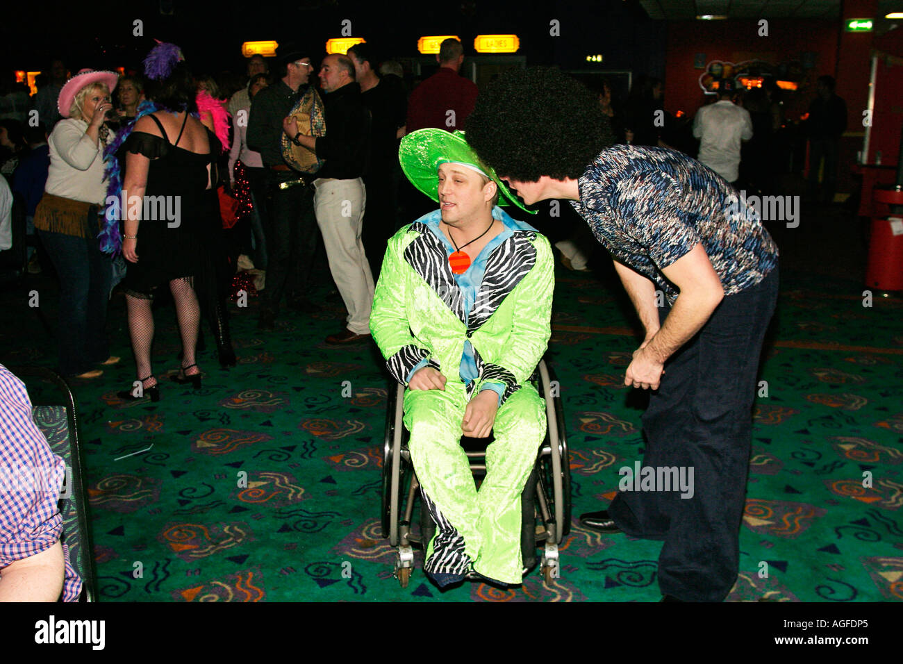 Wheelchair user at 1970s Extravaganza at Butlins Bognor Regis Stock