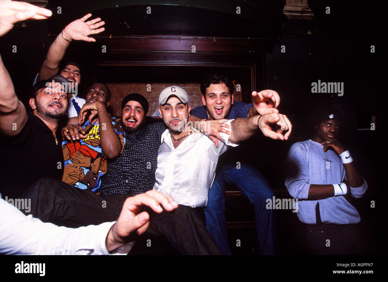 Group of asian youths pointing at camera Stock Photo