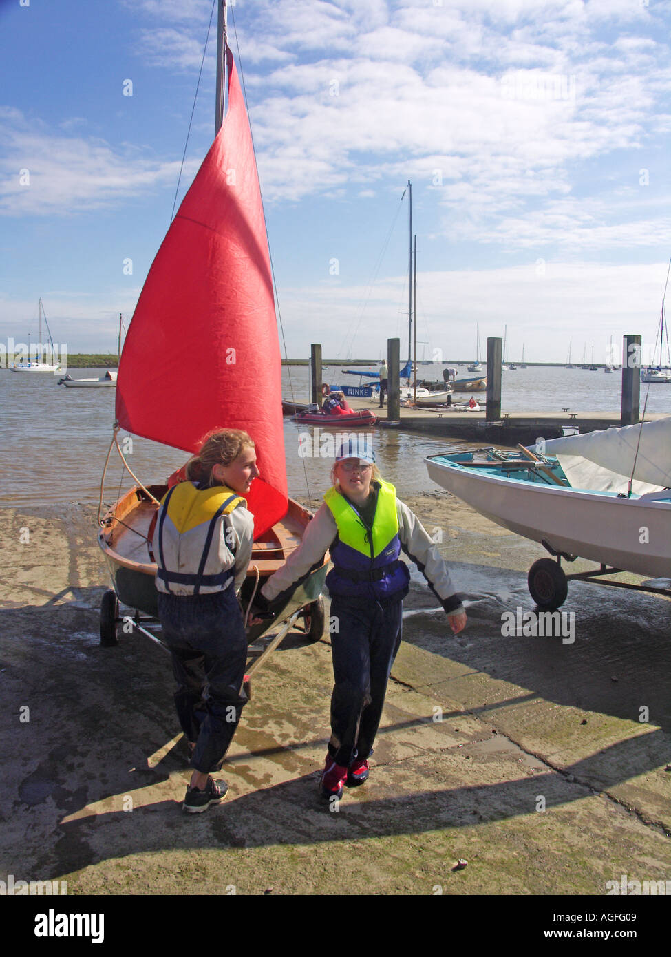 Mirror dinghy with red sail Orford sailing club Suffolk England Stock