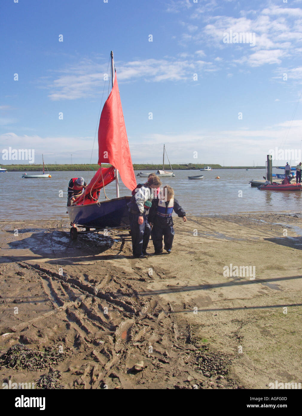 Mirror dinghy with red sail Orford sailing club Suffolk England Stock