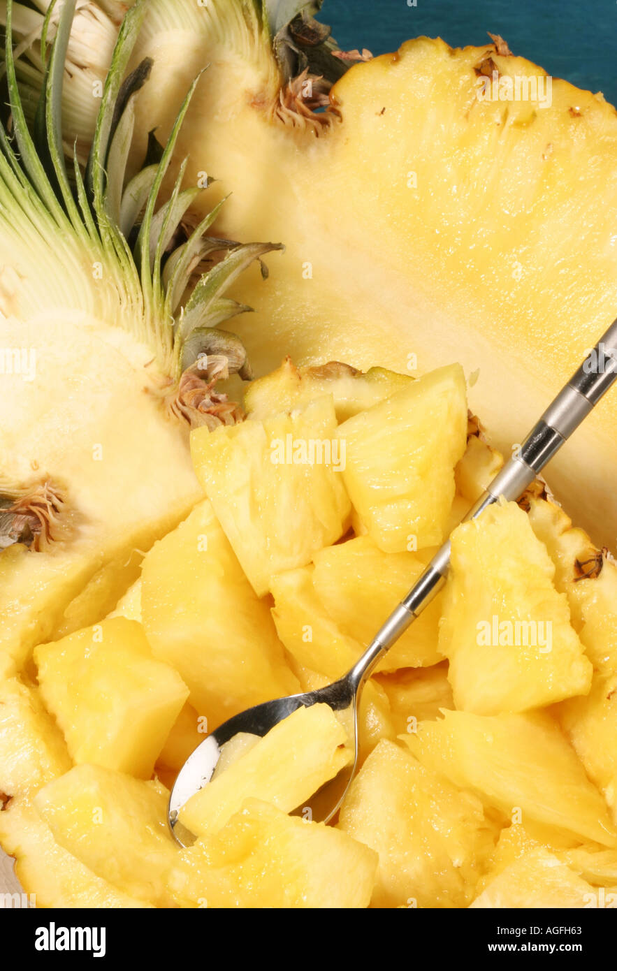 A Pineapple cut in half with segments Stock Photo Alamy