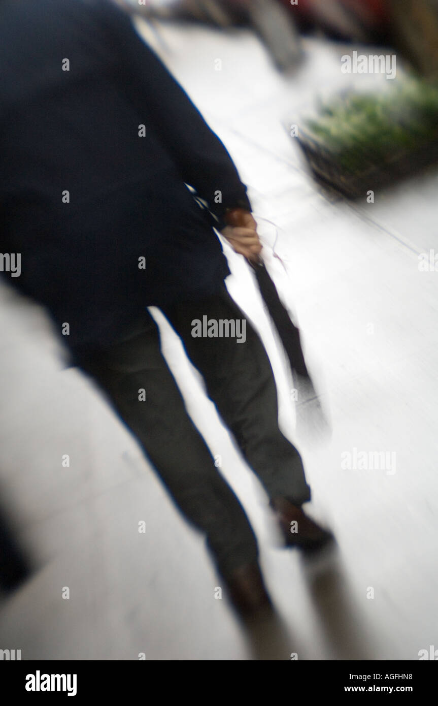Man walking down the street - blurry Stock Photo