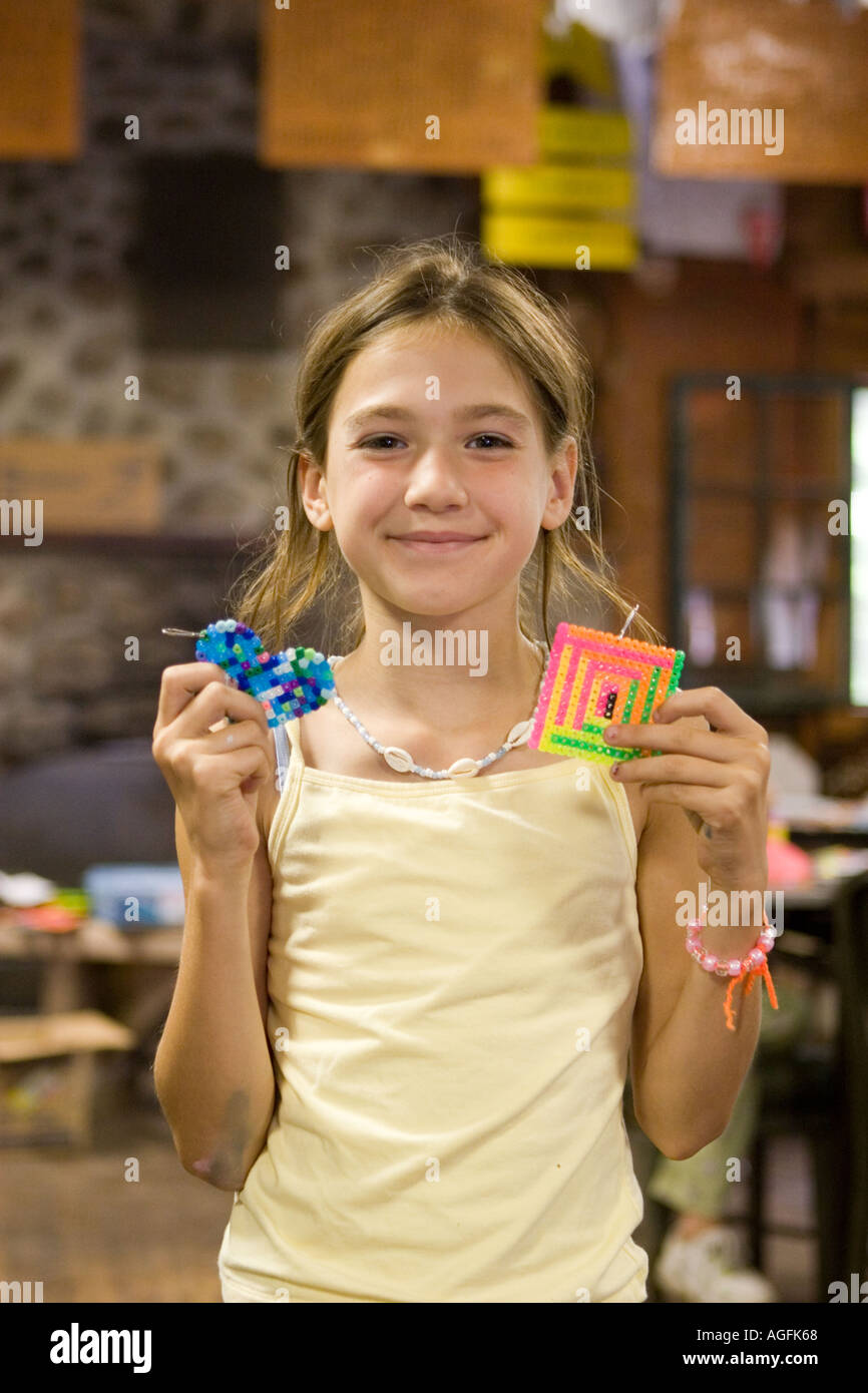 Girl displays craft work at summer camp Stock Photo