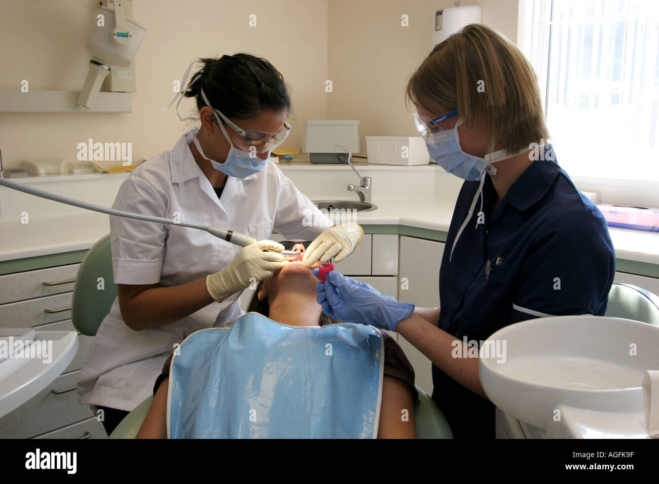 Dental Surgery Dentist nurse and patient having a polish Stock Photo