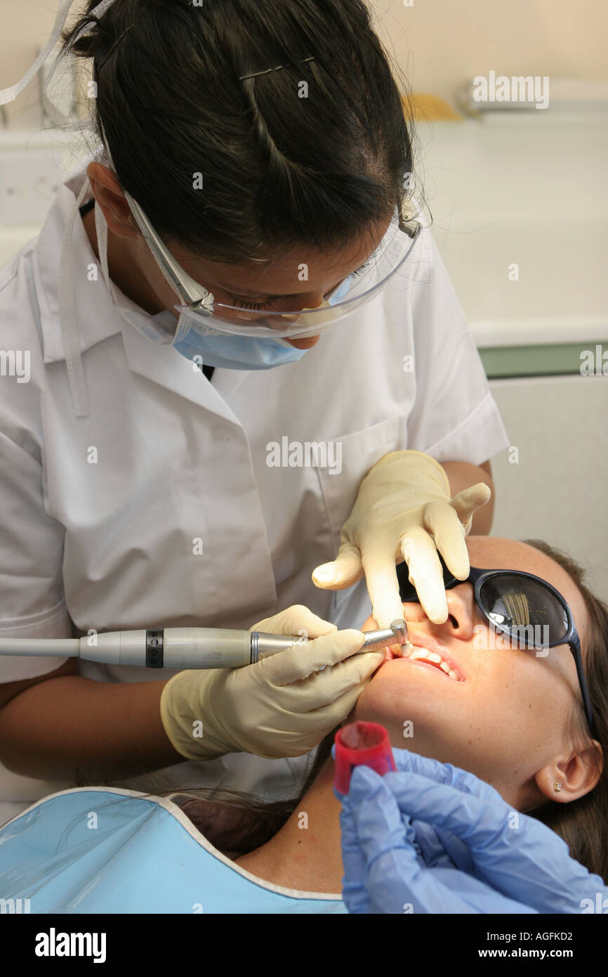 Dental Surgery Dentist and patient being examined Stock Photo