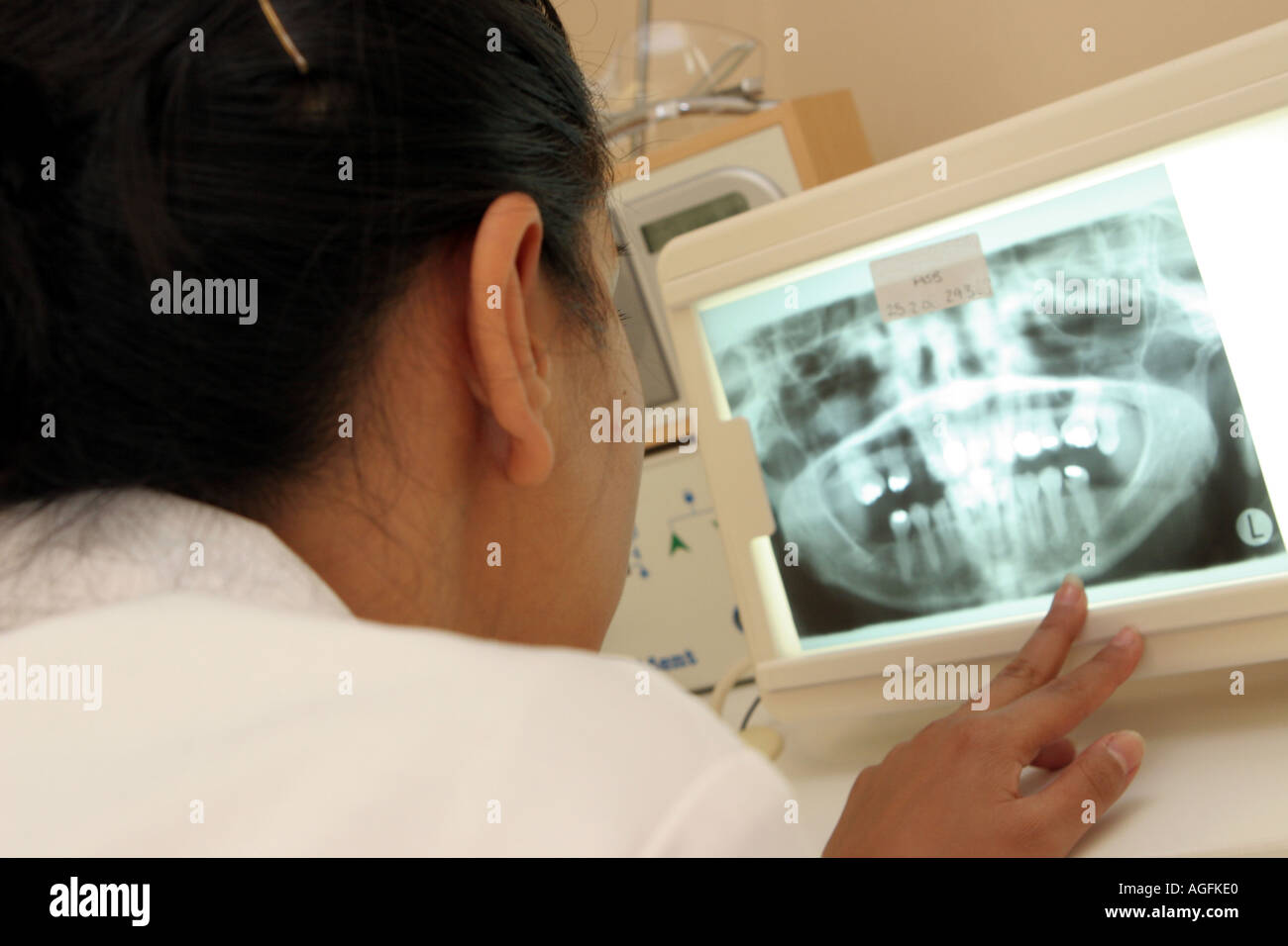 Dental Surgery Dentist looking at xray  Stock Photo