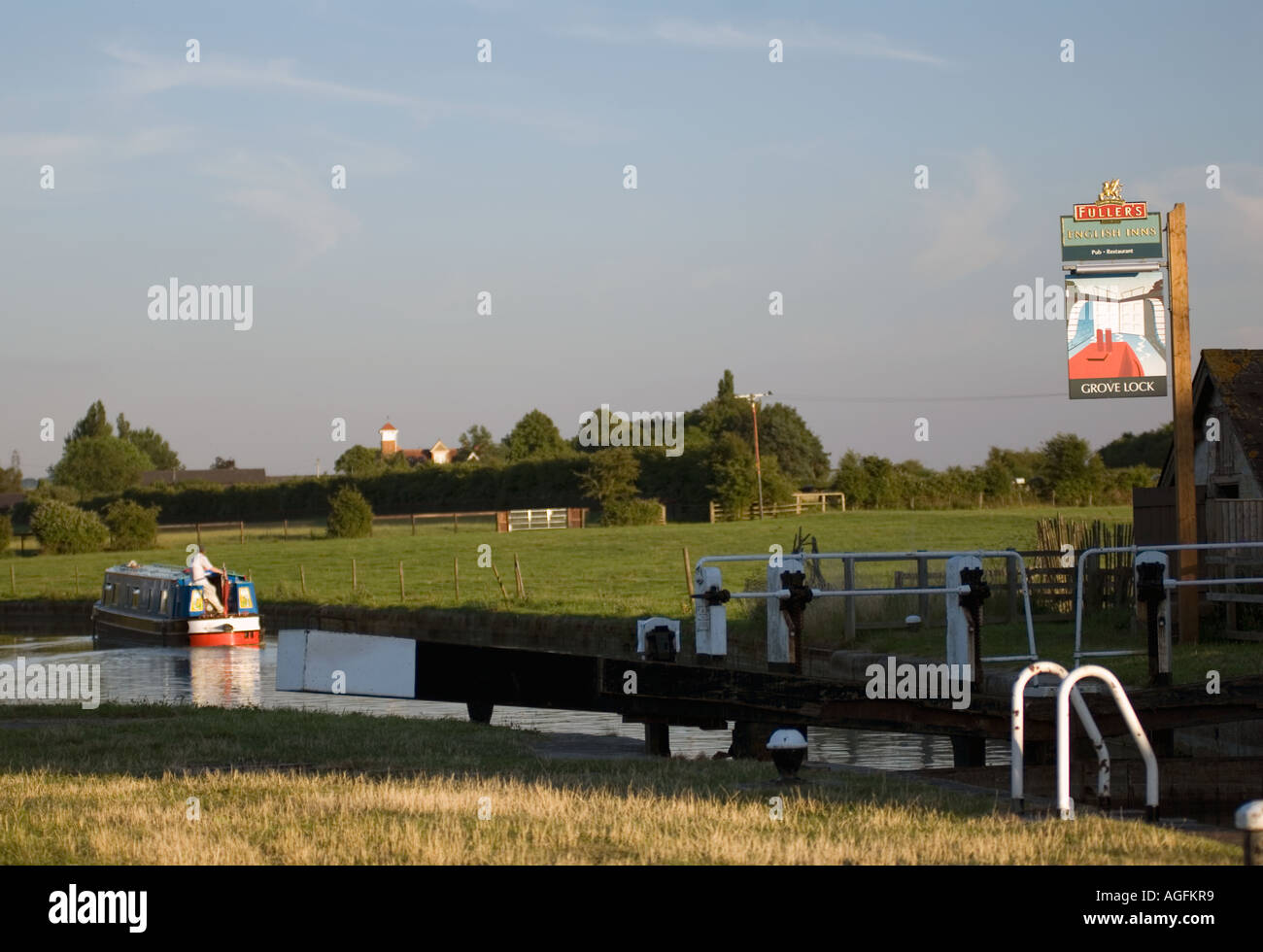 Traditional canal narrowboat at sunset on the Grand Union Canal Stock Photo