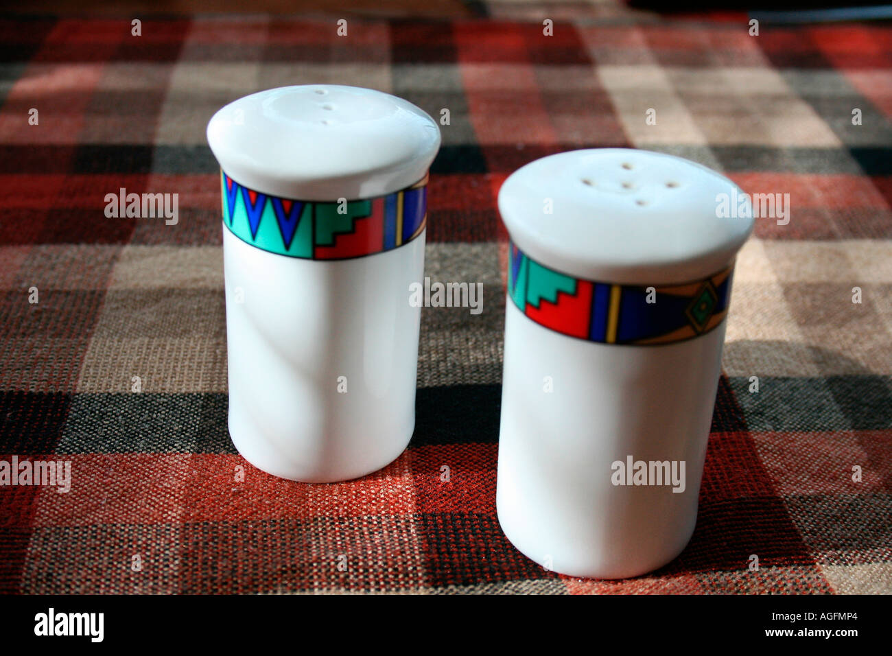 Salt and pepper bottles arranged on a dining table Stock Photo Alamy