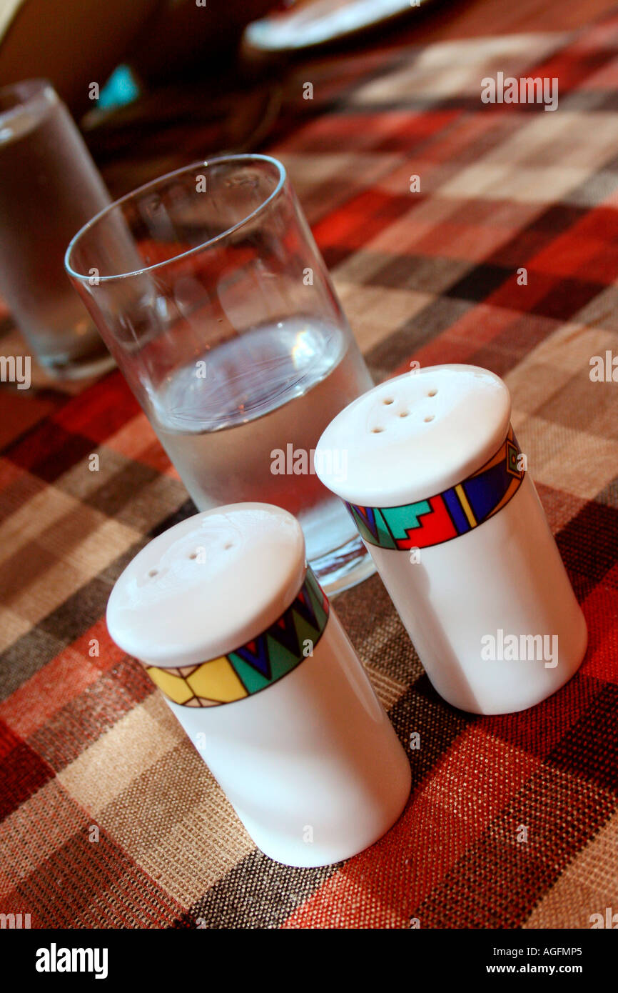 Salt and pepper bottles arranged on a dining table Stock Photo Alamy