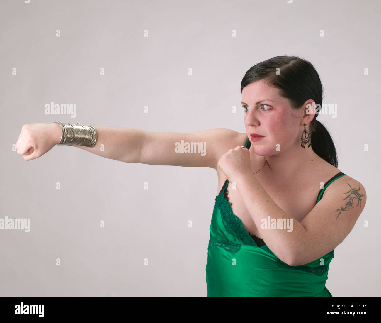 Woman in negligee shadow boxing Stock Photo