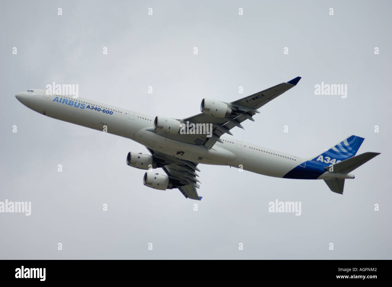A side-view of an Airbus A340-600 taking off, flying in the air. Stock Photo